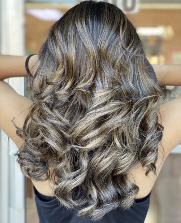 Ash blonde balayage curls, back view