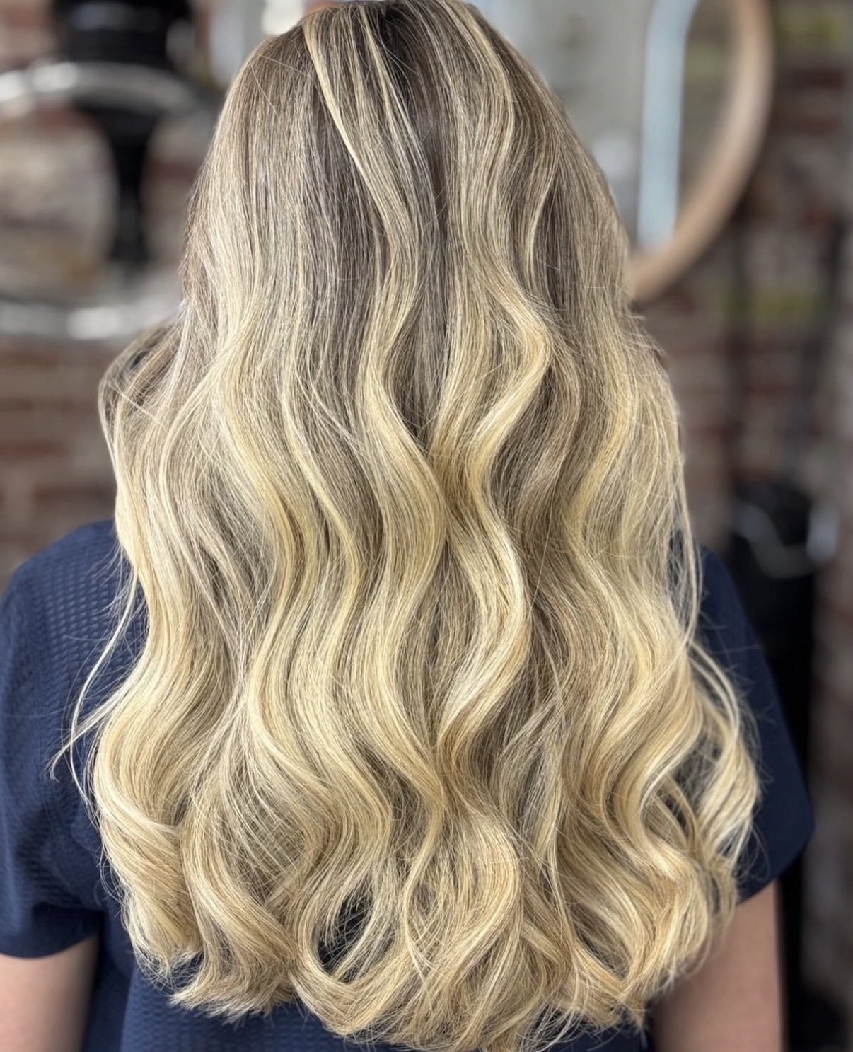 Beachy blonde balayage, finished waves