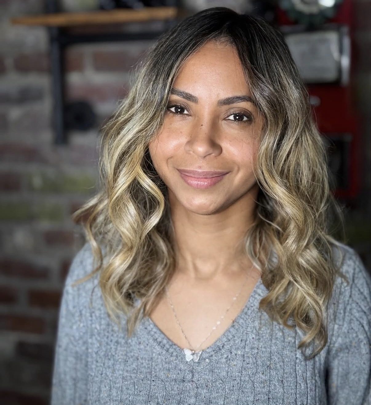 Soft blonde balayage framing the face