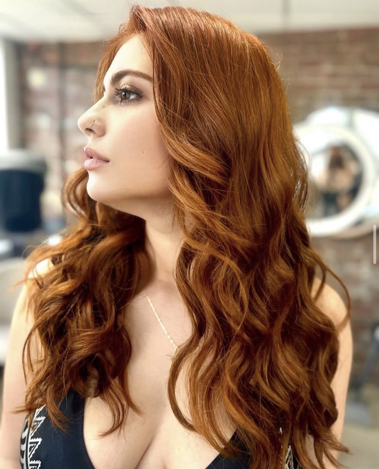 Vivid copper red color, finished waves